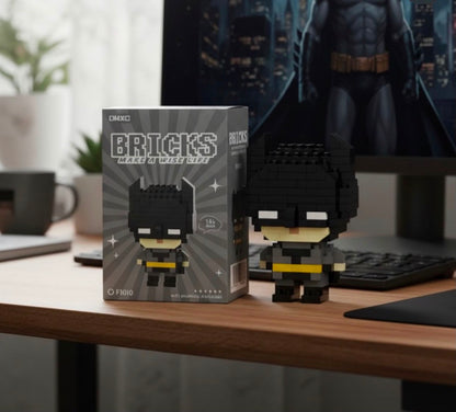 Chibi Batman building block figure displayed on a desk next to keyboard and monitor