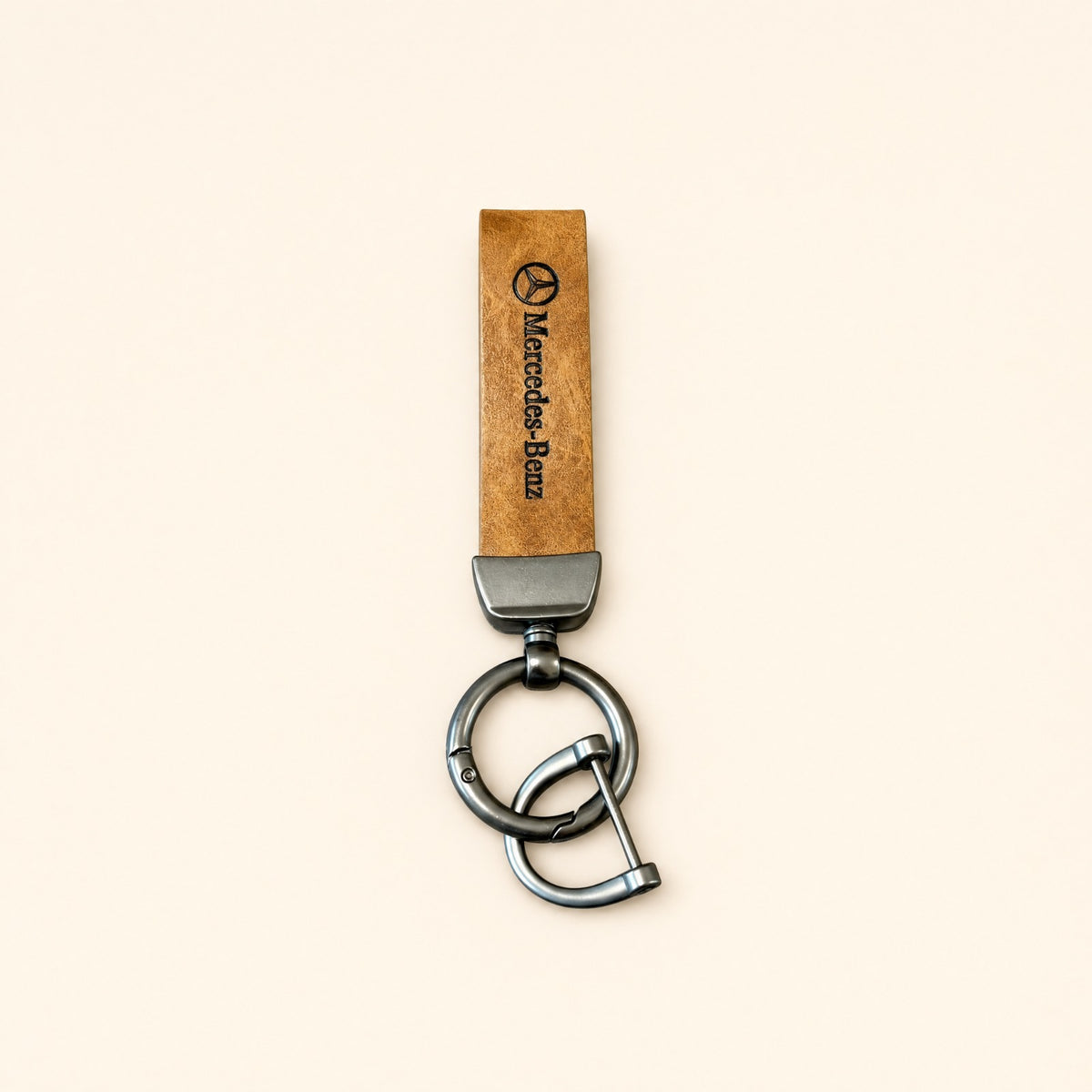 Classic Tan Leather Car Keychain featuring a Mercedes-Benz logo strap and dark metallic keyring hardware.   