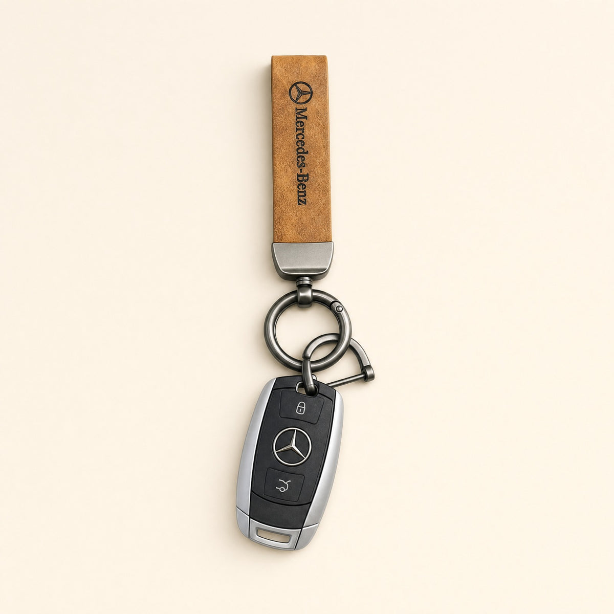 Classic Tan Leather Car Keychain featuring a Mercedes strap and dark metallic keyring hardware.   
